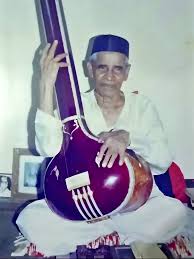 Portrait of Pandit Vishnu Narayan Bhatkhande with classical musical notation in the background